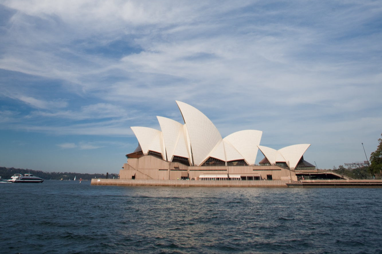 Iconic Sydney Opera House at sunrise, featured in the background to represent Optimus Cleaning’s local, professional services across the Sydney region.